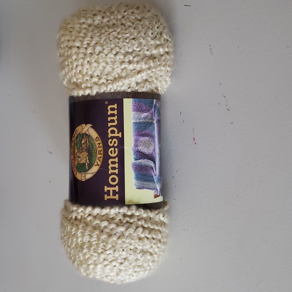 Cream colored skien of yarn (size 5)